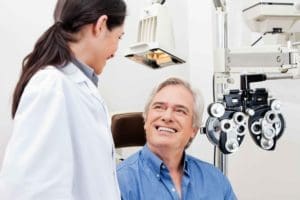 happy eye doctor and patient